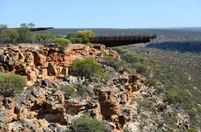 Cantilevered Kalbarri Skywalk projects from the rocky cliff above the Murchison River gorge.