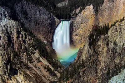 Lower Falls of the Yellowstone River with rainbow in mist viewed from Artist Point
