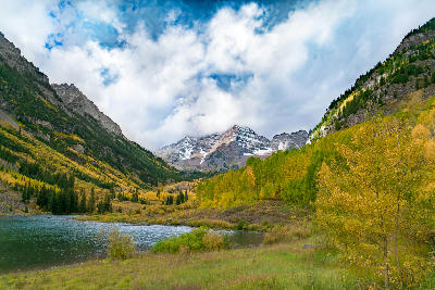 Maroon Creek Valley with autumn aspens and low cloud over the Maroon Bells, Aspen Colorado