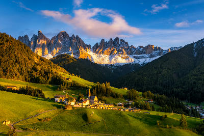 Santa Maddalena village and Church of St. Magdalena with the Odle peaks in Val di Funes, Dolomites, Italy.