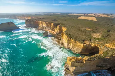 Aerial view of limestone cliffs, sea stacks and turquoise ocean along the Shipwreck Coast near Port Campbell, Victoria.