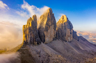 Tre Cime di Lavaredo mountain peaks at sunrise in the Dolomites, Italy.