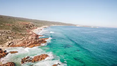 Aerial view of the turquoise coastline and rocky outcrops surrounding Injidup Natural Spa near Yallingup, Western Australia.