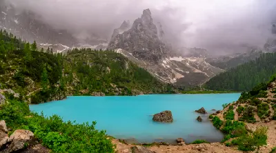Turquoise Lago di Sorapis alpine lake beneath the Sorapis mountains in the Dolomites, Italy.