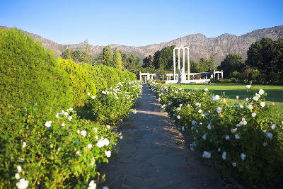 Huguenot Monument in Franschhoek with mountain backdrop in the Cape Winelands of South Africa.