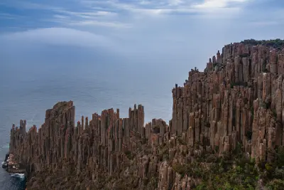 Dramatic columnar dolerite cliffs overlooking the ocean at Cape Raoul, Tasmania.