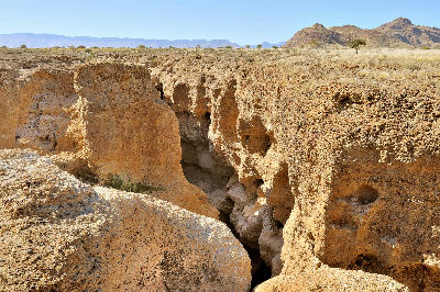 Rocky canyon cliffs and narrow gorge at Sesriem Canyon near Sossusvlei in Namibia.