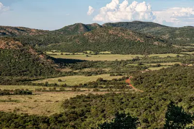 Elevated view of the rolling hills, valleys and bushveld landscape of the Vredefort Dome in South Africa.