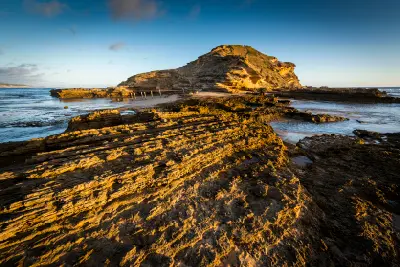 Golden-hour view of the fossilised dune headland and sandstone rock platforms at Gericke's Point near Sedgefield on the Garden Route.