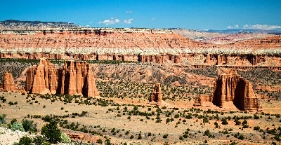 Sandstone temple formations and open desert basin in Cathedral Valley Capitol Reef National Park Utah