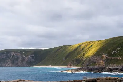 Coastal cliffs, ocean and viewing platform near Natural Bridge in Torndirrup National Park, Western Australia.
