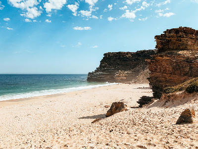 White sand and layered cliffs at Dias Beach near Cape Point on the Cape Peninsula in Table Mountain National Park, South Africa.