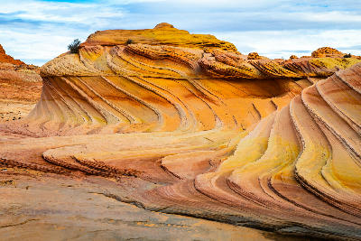 Curved sandstone layers and flowing rock patterns at The Wave in Coyote Buttes North Arizona