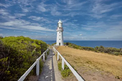 Walking path leading directly to Cape Otway Lightstation with the Southern Ocean behind, Victoria, Australia.