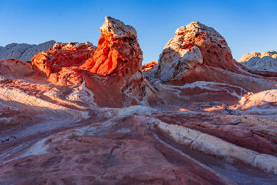 Swirling red and white sandstone formations at White Pocket in northern Arizona, part of the Vermilion Cliffs National Monument.