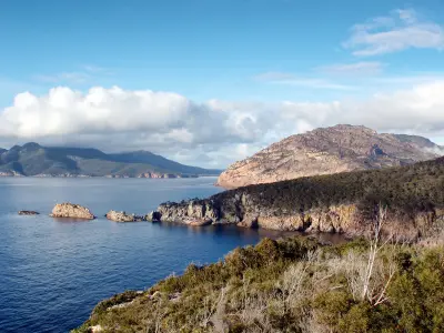 Coastal view from Cape Tourville across granite headlands and the Tasman Sea in Freycinet National Park, Tasmania.