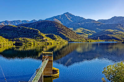 Koos Raubenheimer Dam and water extraction tower beneath the Swartberg Mountains near Oudtshoorn in the Klein Karoo, Western Cape, South Africa.