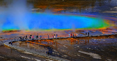 Grand Prismatic Spring Yellowstone National Park with boardwalk tourists and rising steam Wyoming USA
