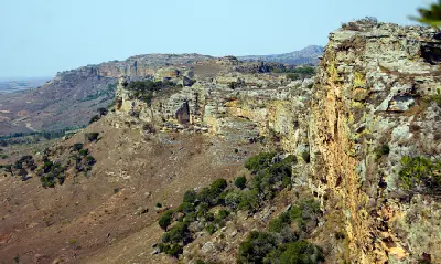 Layered sandstone cliffs and dry canyon slopes in Isalo National Park, southwestern Madagascar