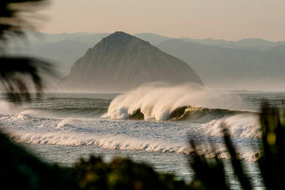 Wave breaking in front of Morro Rock on the Central California Coast at Morro Bay.