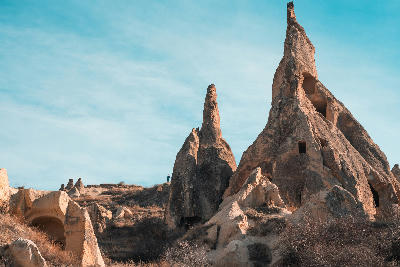 Rock-cut churches and cave dwellings carved into volcanic cliffs at Göreme Open Air Museum in Cappadocia, Turkey.