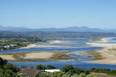 Panoramic view of the Keurbooms Estuary showing tidal channels, sandbanks and distant mountain ranges near Plettenberg Bay on South Africa’s Garden Route.