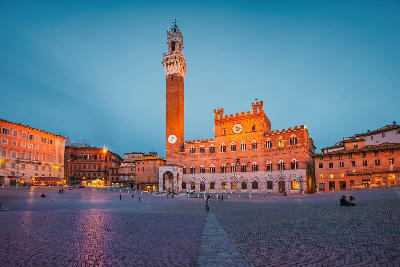 Night view of Piazza del Campo in Siena, featuring the Palazzo Pubblico and Torre del Mangia, Tuscany,