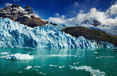 Spegazzini Glacier ice wall with turquoise glacial lake and floating ice in Patagonia, Argentina.