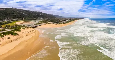 Aerial view of the Touw River Mouth and Wilderness Estuary where the river meets the Indian Ocean along South Africa's Garden Route.