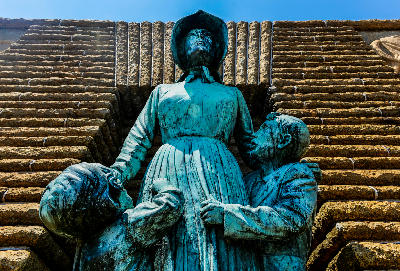 Bronze sculpture of a Voortrekker woman and two children at the entrance to the Voortrekker Monument in Pretoria.