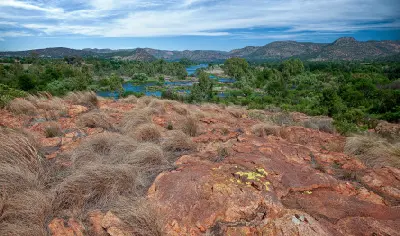 Elevated view of the Vaal River winding through the Vredefort Dome landscape between the Free State and North West provinces.