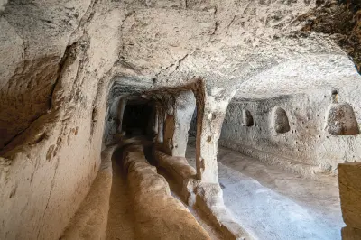 Carved underground passage and chamber inside Derinkuyu Underground City in Cappadocia, Turkey.