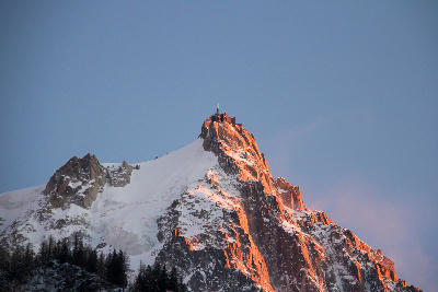 Aiguille du Midi summit at sunset above Chamonix in the Mont Blanc Massif.