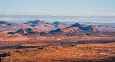 Karoo plains and dolerite hills stretching across Camdeboo National Park near Graaff-Reinet in the Eastern Cape, South Africa.