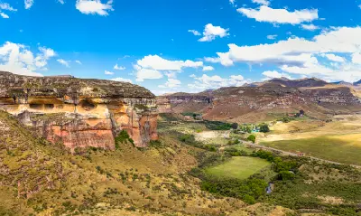 Panoramic view of sandstone cliffs, mountain valleys and grasslands in Golden Gate Highlands National Park, Free State, South Africa.