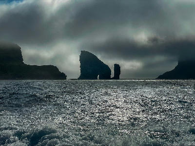 Drangarnir sea stacks with natural arch rising from the Atlantic Ocean near Vágar Island, Faroe Islands