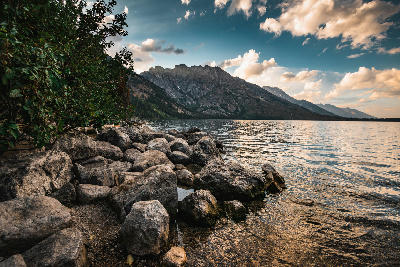 Rocky shore at Jenny Lake within the Grand Teton Alpine Lakes system in Wyoming.