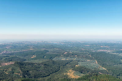 View from Wonder View on the Panorama Route overlooking the Lowveld of Mpumalanga, South Africa, with forestry plantations, rolling hills and distant dams visible.