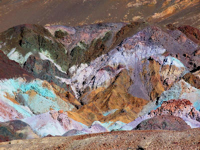 Colorful mineral hills at Artist’s Palette in Death Valley showing green, purple, and yellow rock formations