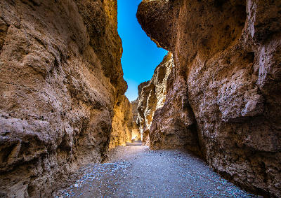 Towering rock walls inside Sesriem Canyon in Namib-Naukluft National Park, Namibia.
