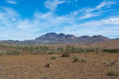 Rugged Flinders Ranges mountains above dry rocky plains and scattered shrubs along Moralana Scenic Drive, South Australia.