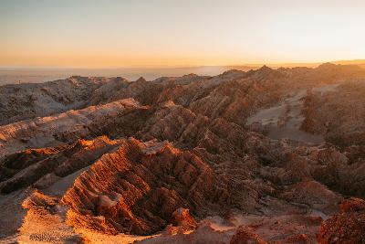 Valle de la Luna desert ridges at sunset in Atacama Chile.