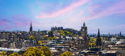 Edinburgh skyline panorama showing the Old Town, New Town, and Edinburgh Castle from Calton Hill.
