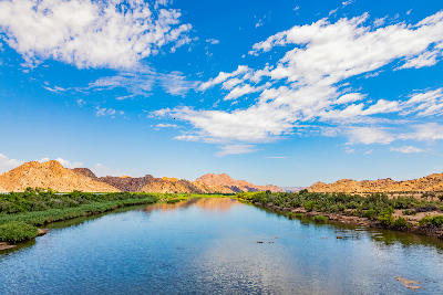 Orange River flowing between rocky canyon walls in Augrabies National Park, Northern Cape, South Africa.