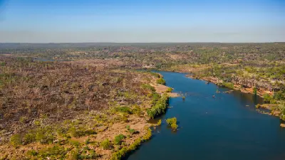 Aerial view of the Mitchell River winding through rugged sandstone and remote savannah woodland on the Mitchell Plateau.