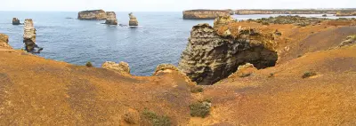 Eroded limestone cliff, sea cave and offshore rock stacks at Bay of Islands, Victoria.