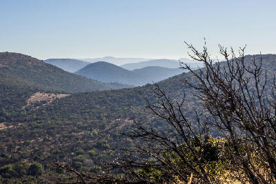 Concentric mountain ridges and valleys of the Vredefort Dome World Heritage Site, formed by an ancient asteroid impact in South Africa.