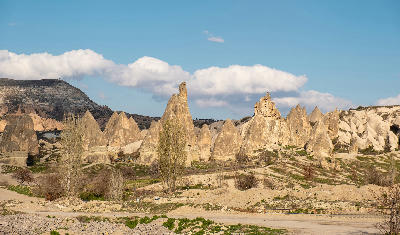 Fairy chimneys and pale volcanic rock formations in White Valley, Cappadocia, Turkey.