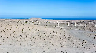 Remote desert cemetery with scattered grave markers near the ghost town of Pomona on Namibia’s Atlantic coast.