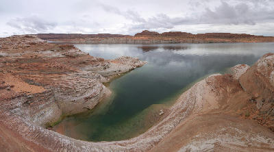 Lake Powell shoreline layered sandstone water level bands Glen Canyon Arizona Utah